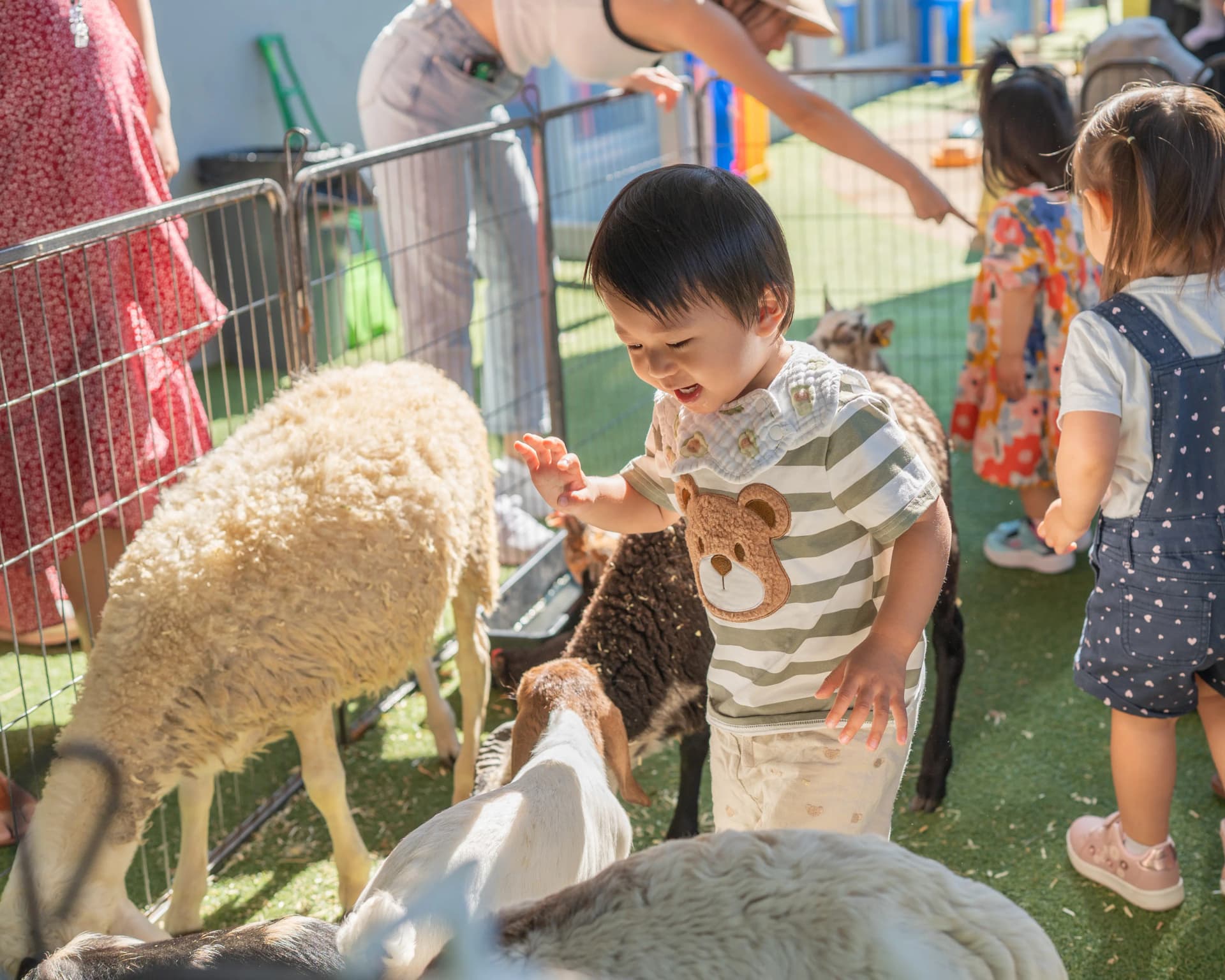 Children engaging with the Simba mascot at a school readiness event