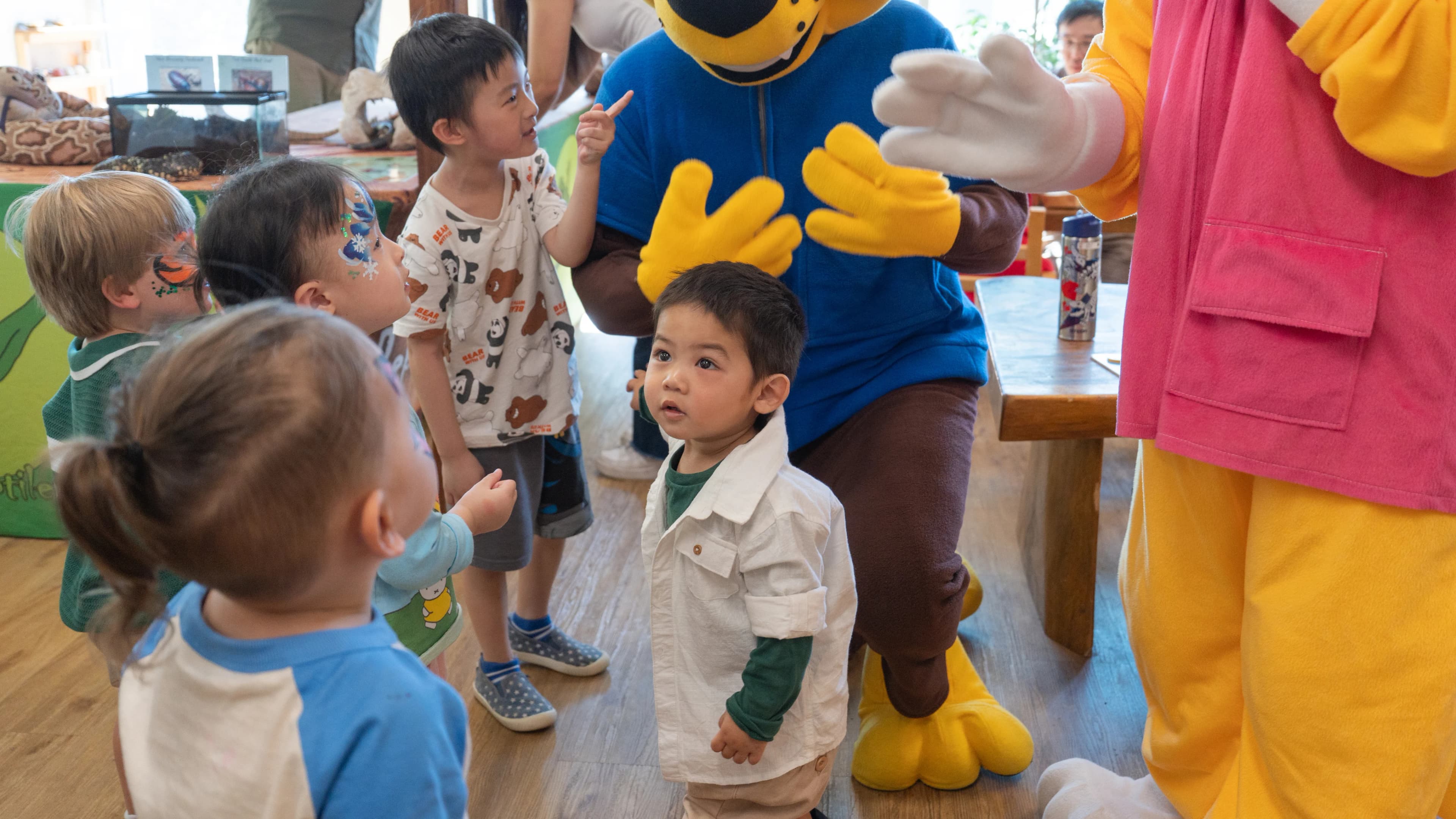 Children engaging with the Simba mascot at a school readiness event