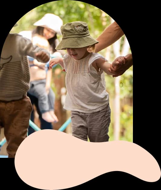 Toddler exploring the outdoor play space at Simba Education