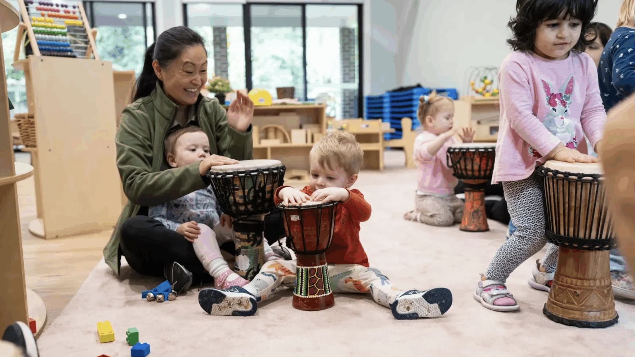Nursery-aged child discovering sensory play in a nurturing learning environment